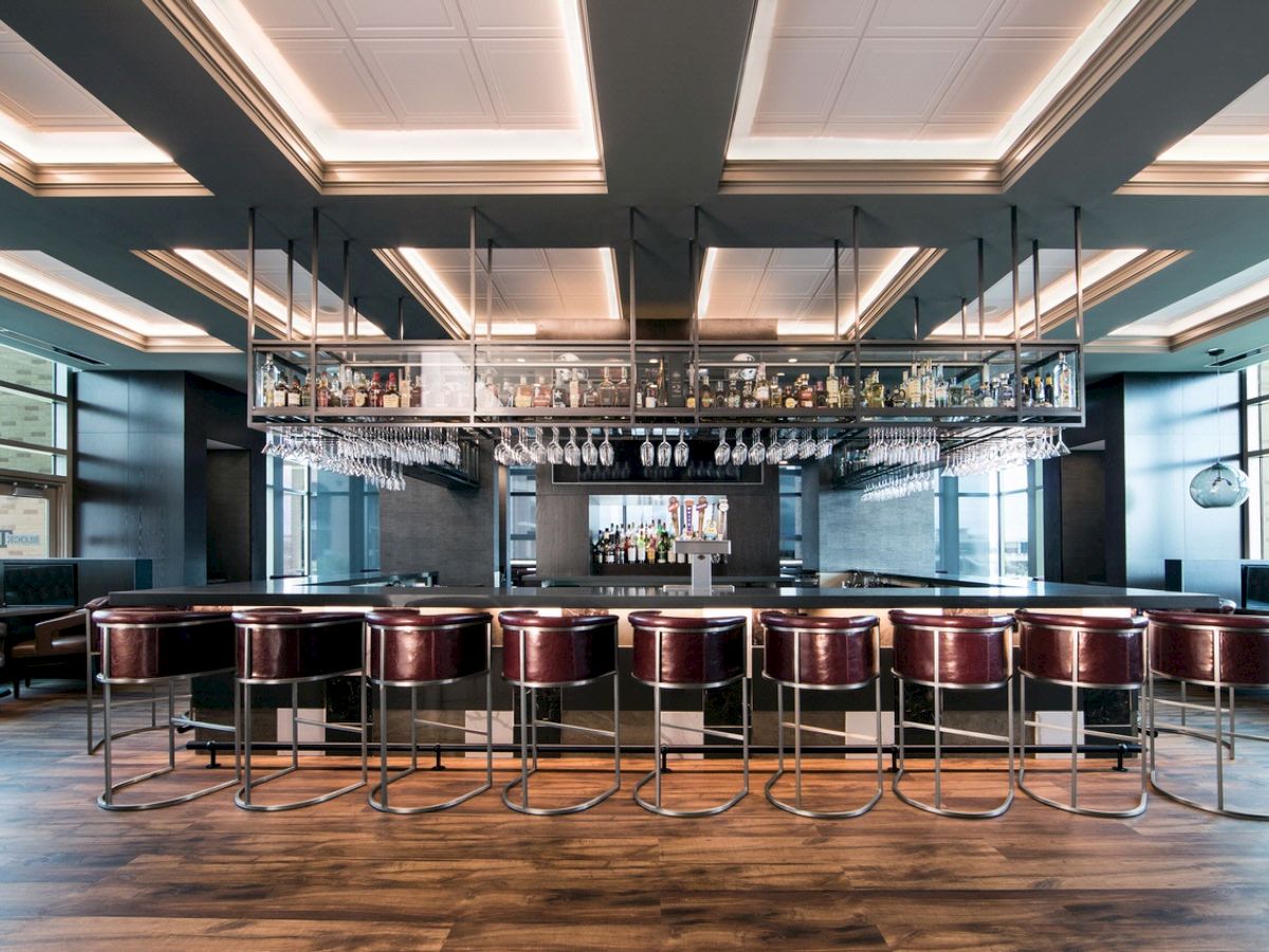 Block T Bar & Grill maroon bar stools lining the bar