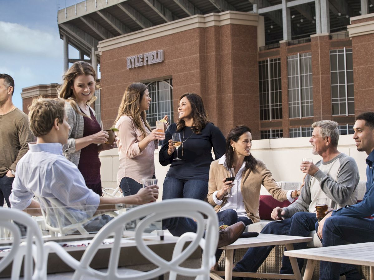 Friends drinking and having conversation on the Block T Bar Patio