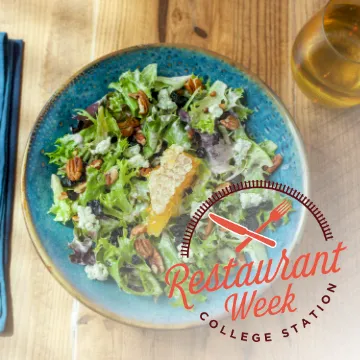 A bowl of mixed salad with greens, nuts, and cheese on a blue plate, with a “Restaurant Week” logo overlay.
