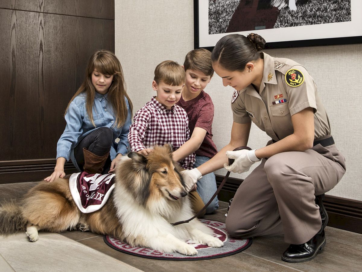 Kids petting Reveille