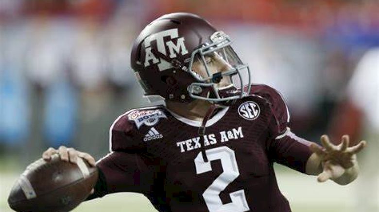 Aggie Football Player throwing a football