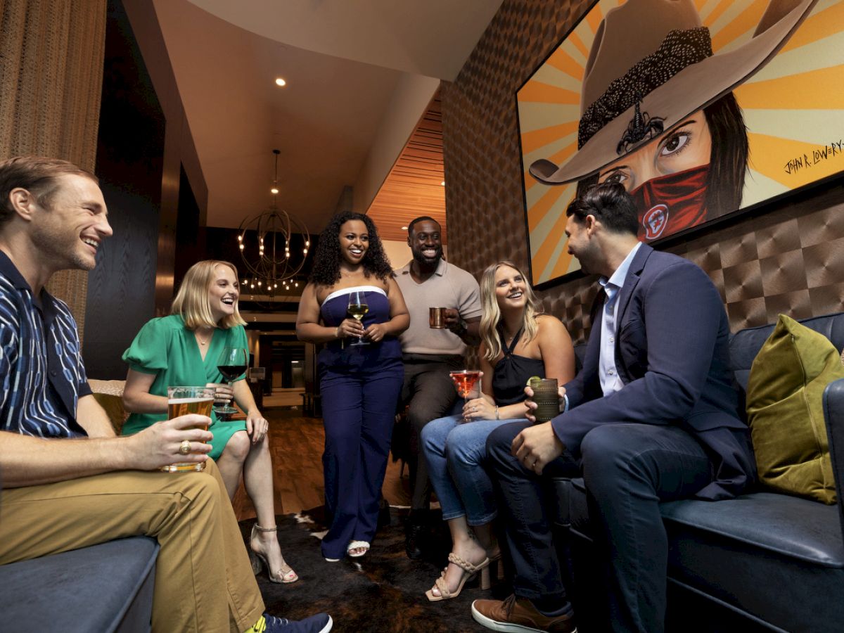 young adults enjoying pre-dinner drink at The Rail