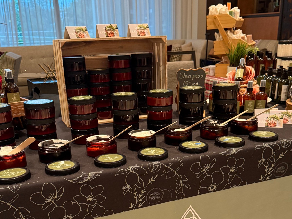 The image shows a display table with various skincare products, including creams and oils, arranged for sale.